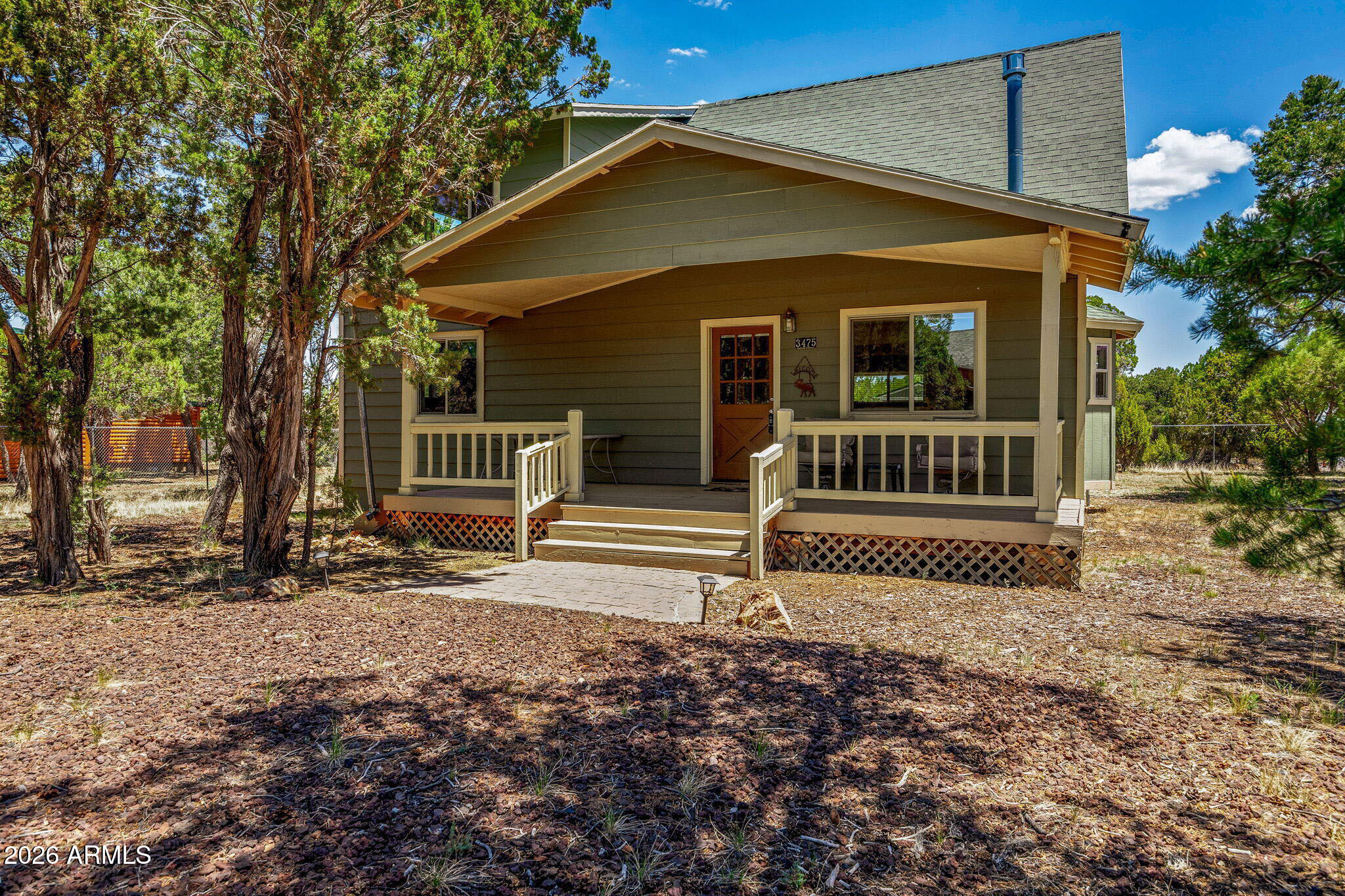 3475 Roundup Circle Heber, AZ 85928 - Photo 4 of 34 a front view of a house with garden