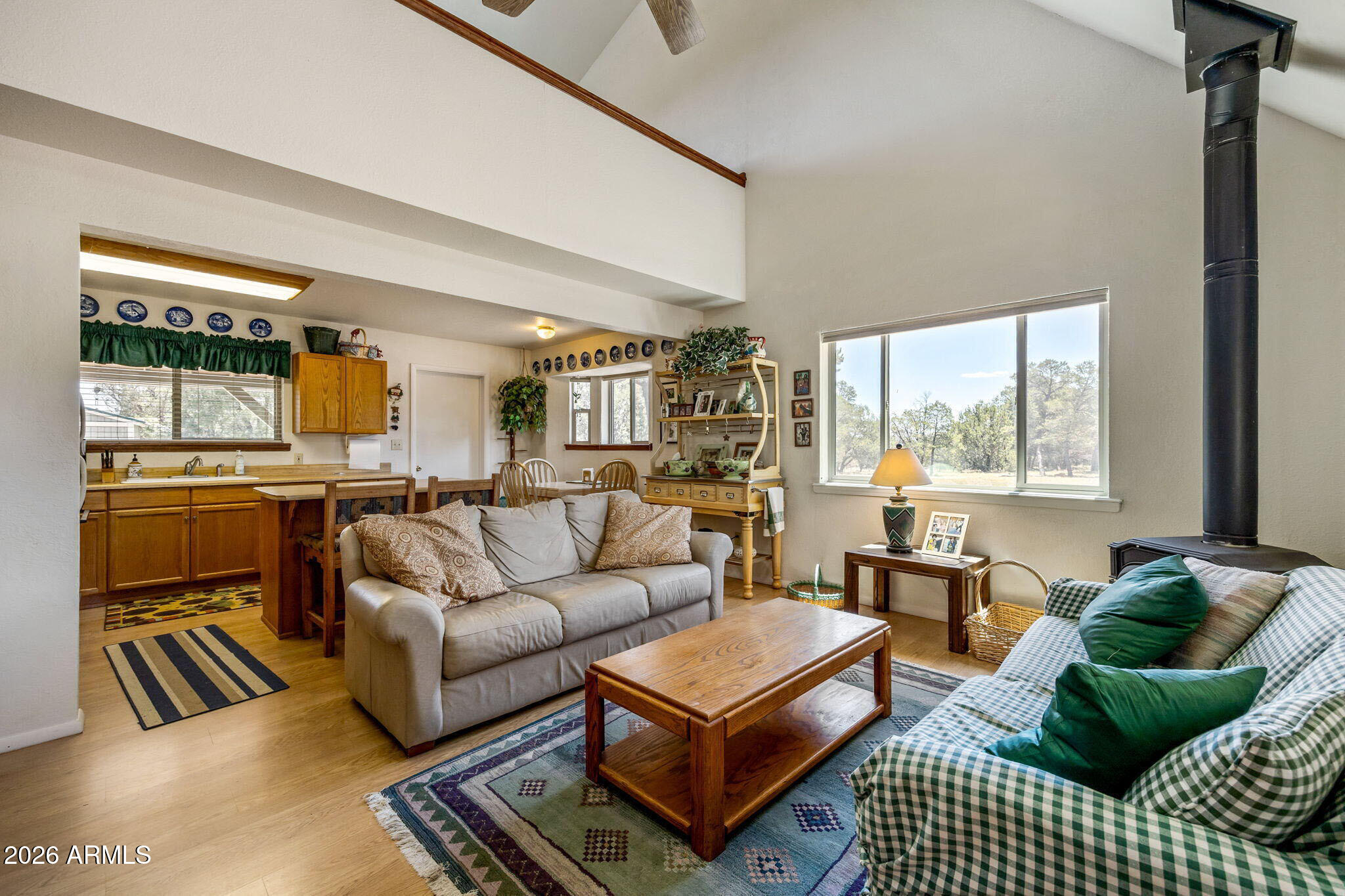 3475 Roundup Circle Heber, AZ 85928 - Photo 7 of 34 a living room with furniture a large window and a table
