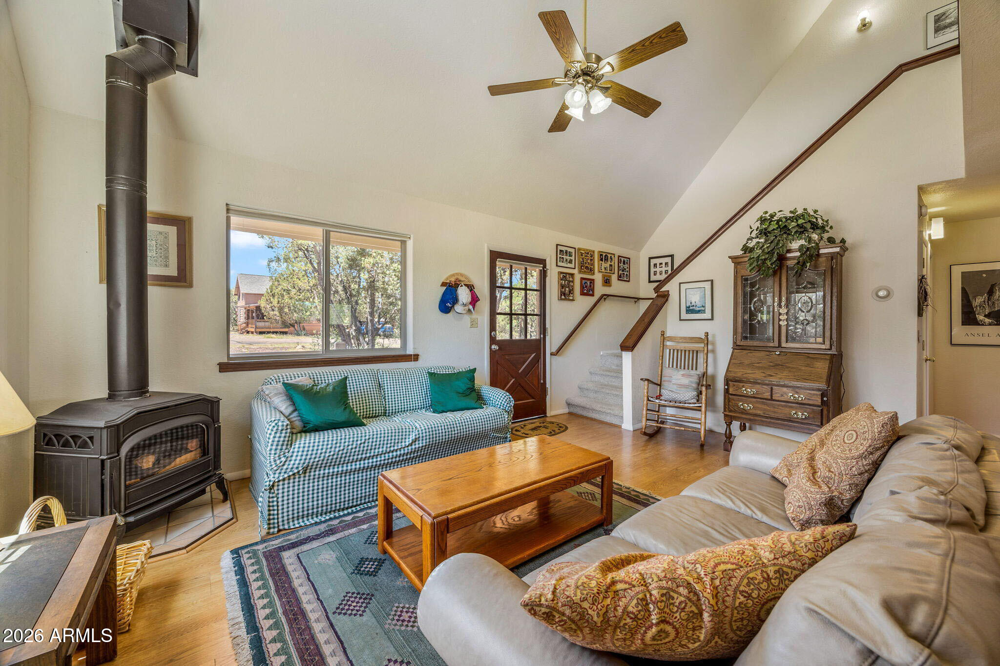 3475 Roundup Circle Heber, AZ 85928 - Photo 8 of 34 a living room with furniture ceiling fan and a window