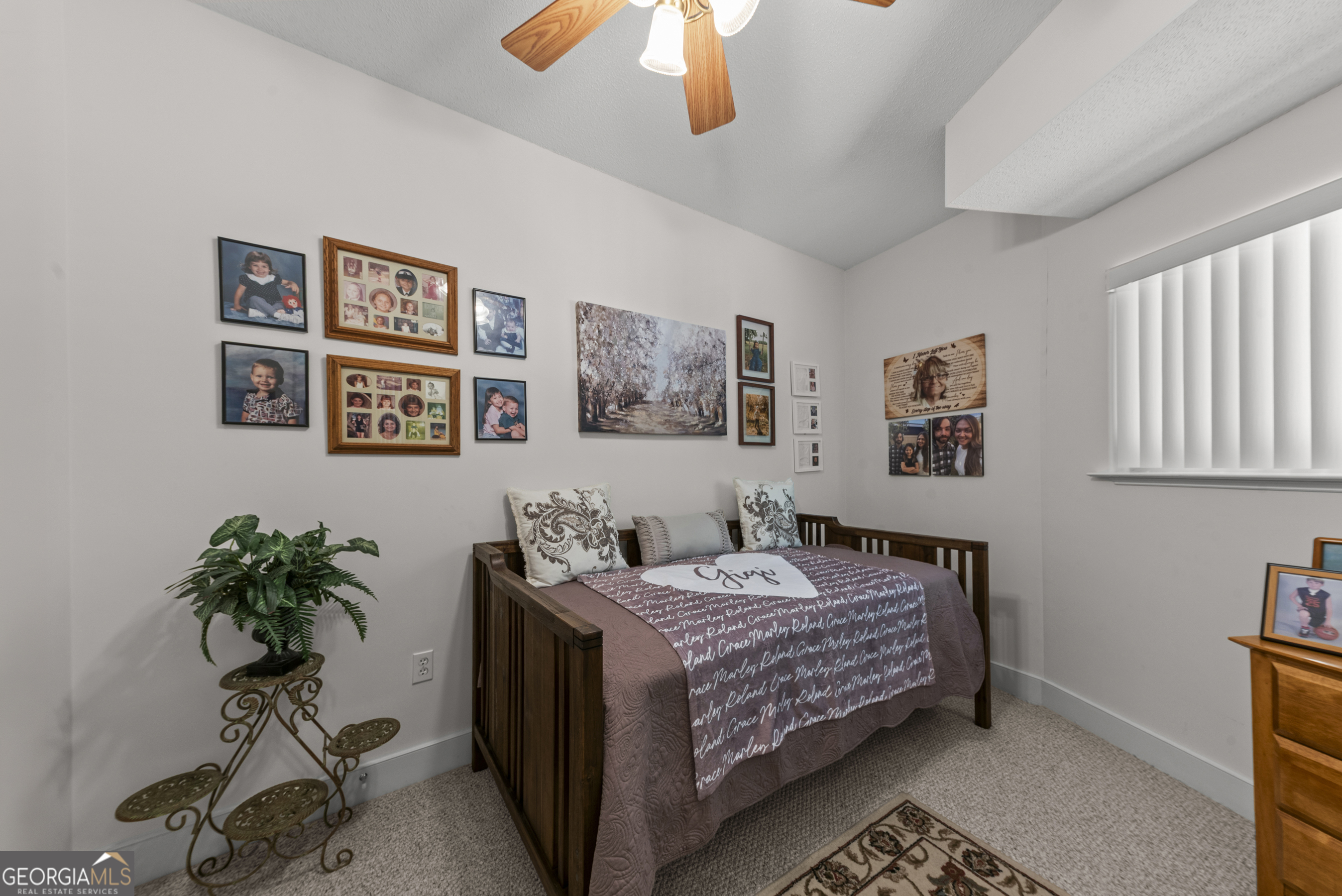 1170 Cedar Grove Road Buckhead, GA 30625 - Photo 30 of 51 a bedroom with a bed and a potted plant