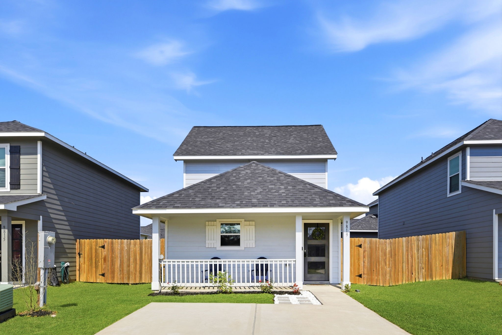 9819 Emerald Stone Way Conroe, TX 77306 - Photo 1 of 38 a front view of a house with a yard and garage