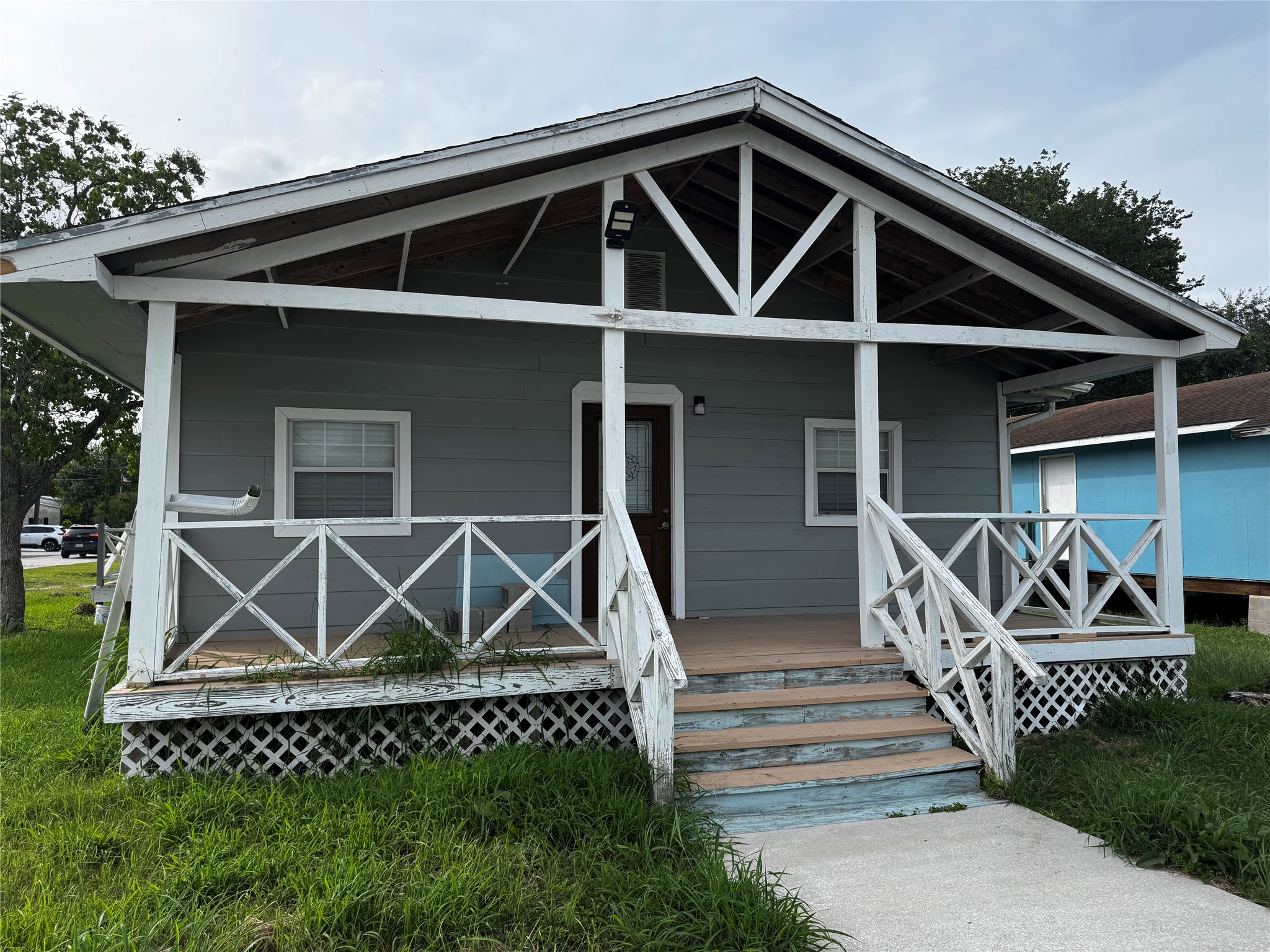 4515 7th Street Bacliff, TX 77518 - Photo 1 of 15 a front view of a house with wooden stairs
