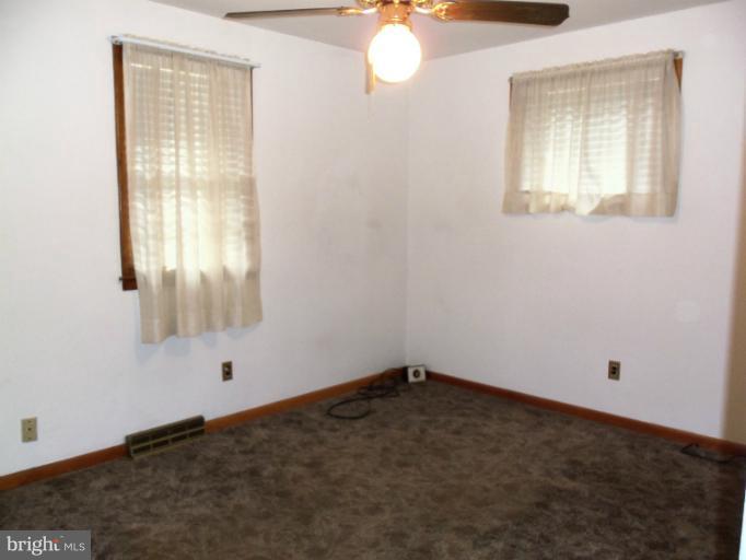 8010 Sagramore Road Rosedale, MD 21237 - Photo 13 of 14 an empty room with a window