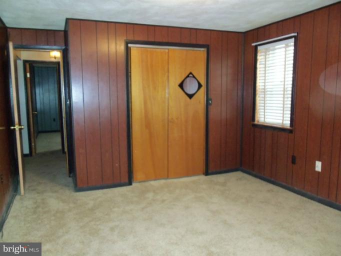 8010 Sagramore Road Rosedale, MD 21237 - Photo 5 of 14 an empty room with windows and closet