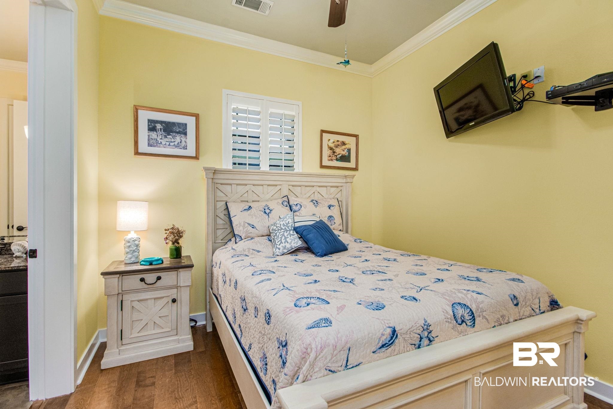 1430 Regency Road, Unit I201 Gulf Shores, AL 36542 - Photo 10 of 34 Bedroom featuring ceiling fan, ornamental molding, and dark hardwood / wood-style flooring