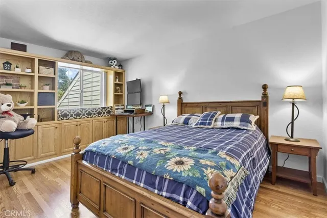 a bedroom with a bed and a cabinets