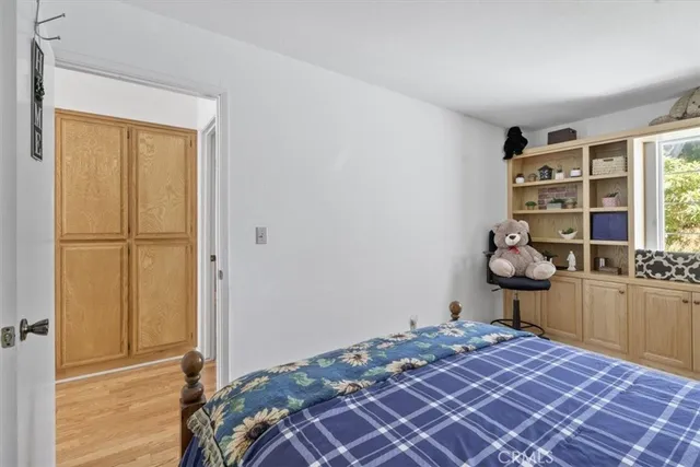 a bedroom with a bed and a dresser