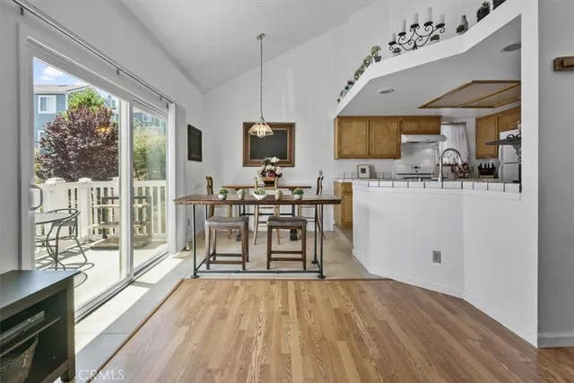 a kitchen with a sink a stove and cabinets