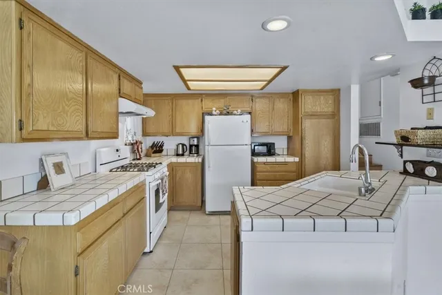 a view of living room with granite countertop furniture and fireplace