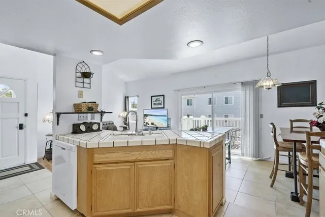 a view of a kitchen with furniture and flat screen tv