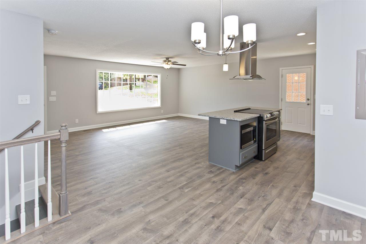 317 East Pilot Street Durham, NC 27707 - Photo 12 of 30 a kitchen with a wooden floor