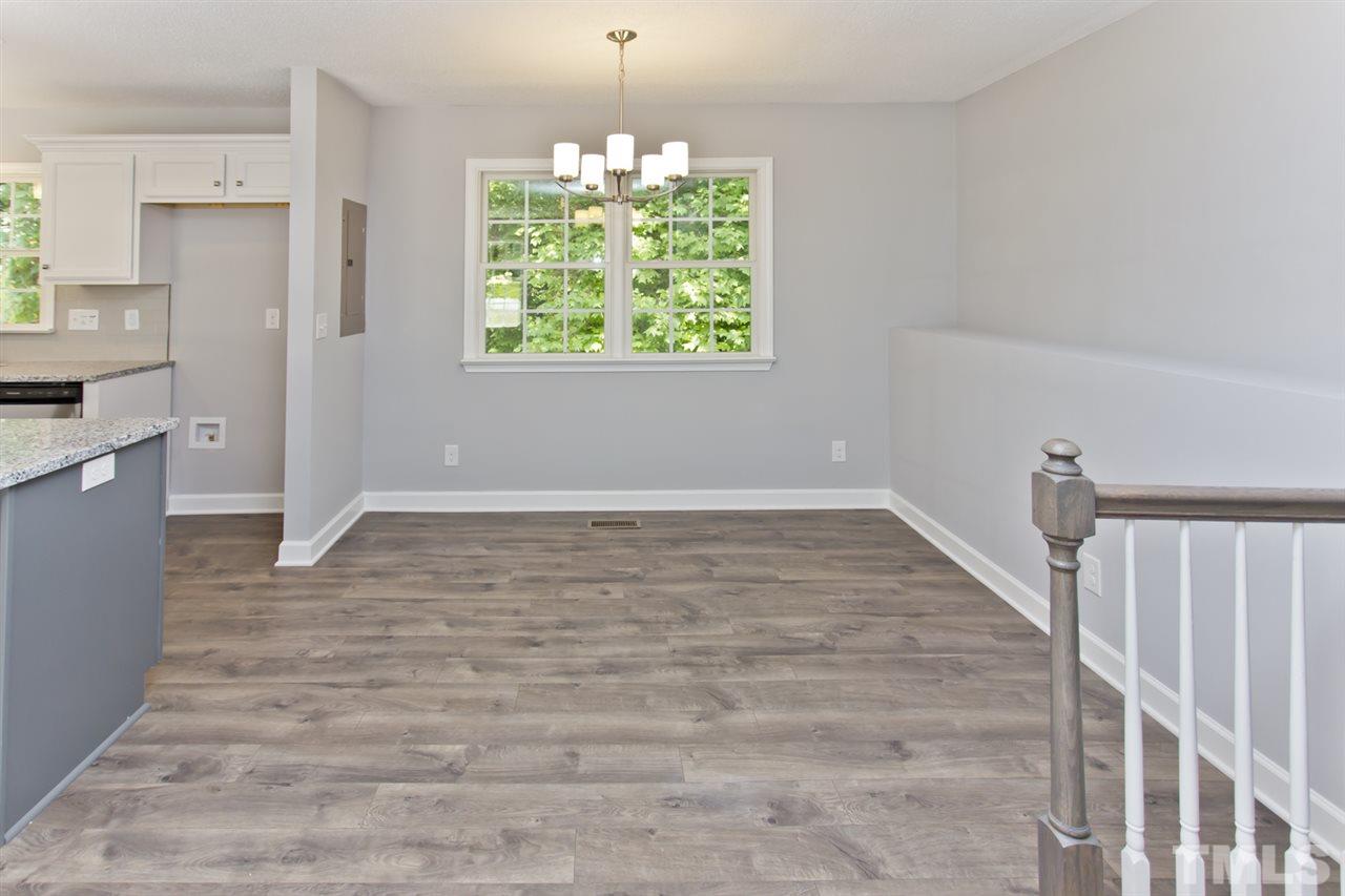 317 East Pilot Street Durham, NC 27707 - Photo 13 of 30 a view of an empty room with wooden floor and a window