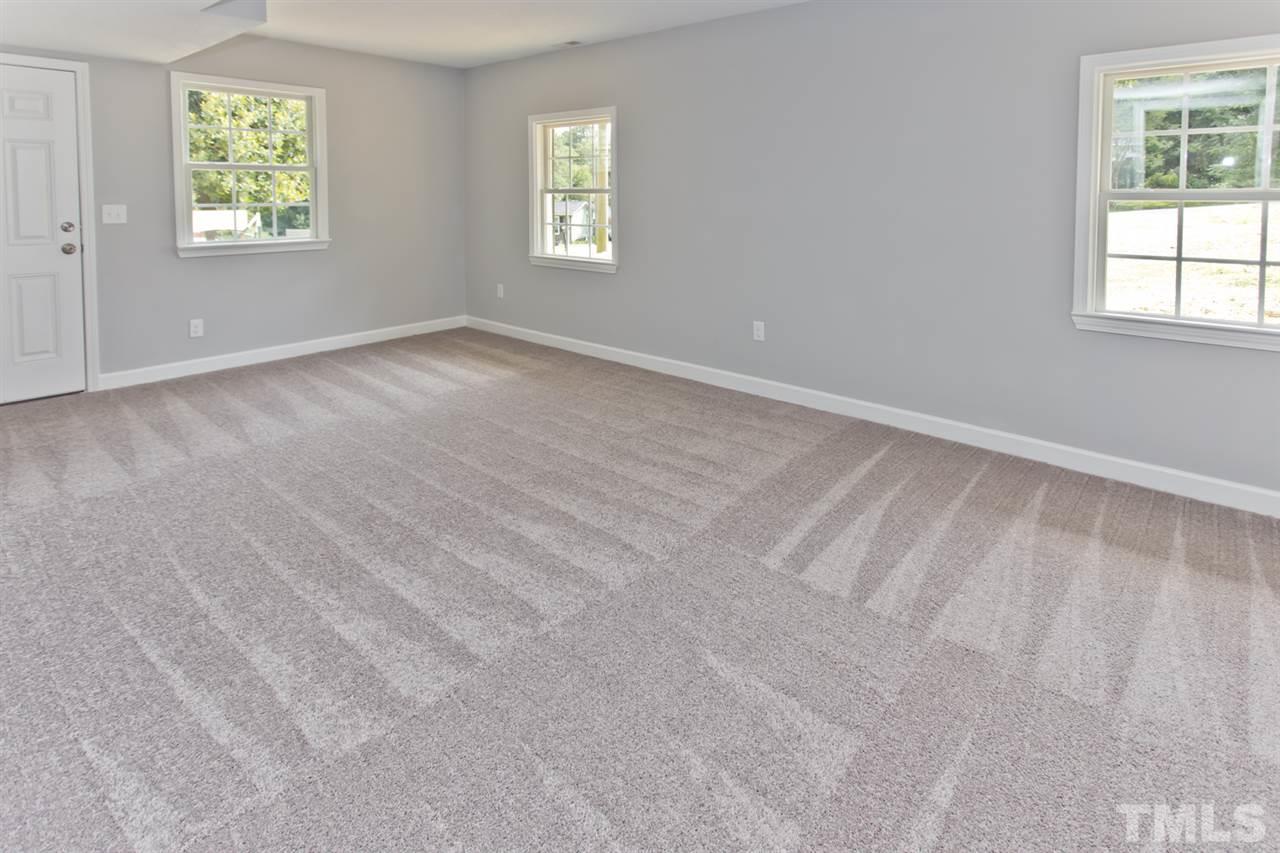 317 East Pilot Street Durham, NC 27707 - Photo 17 of 30 an empty room with windows