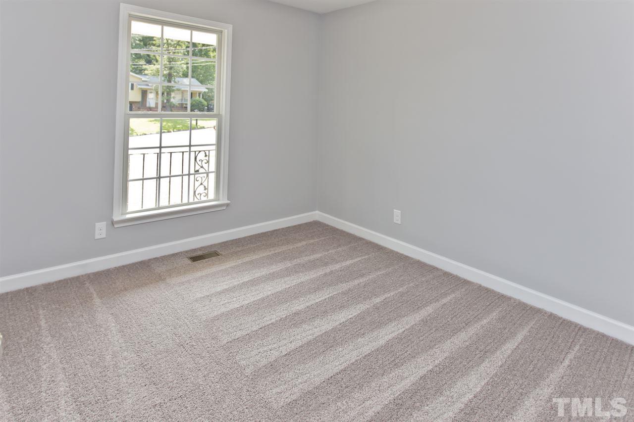 317 East Pilot Street Durham, NC 27707 - Photo 20 of 30 an empty room with a window