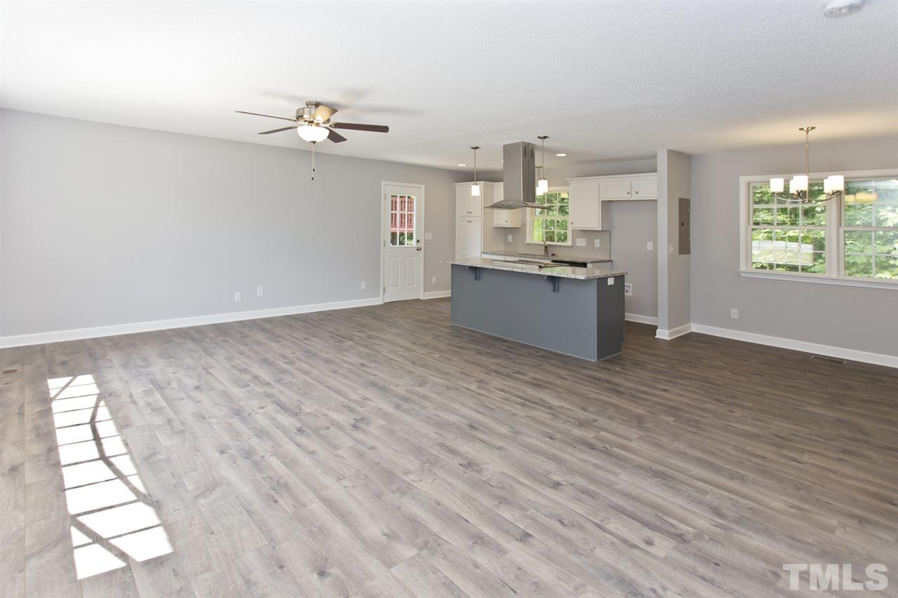 317 East Pilot Street Durham, NC 27707 - Photo 3 of 30 wooden floor in an empty room with a window