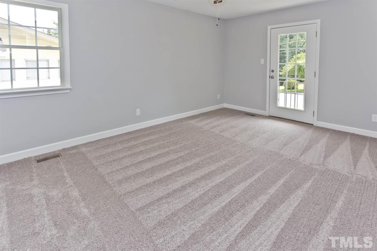 317 East Pilot Street Durham, NC 27707 - Photo 21 of 30 an empty room with windows