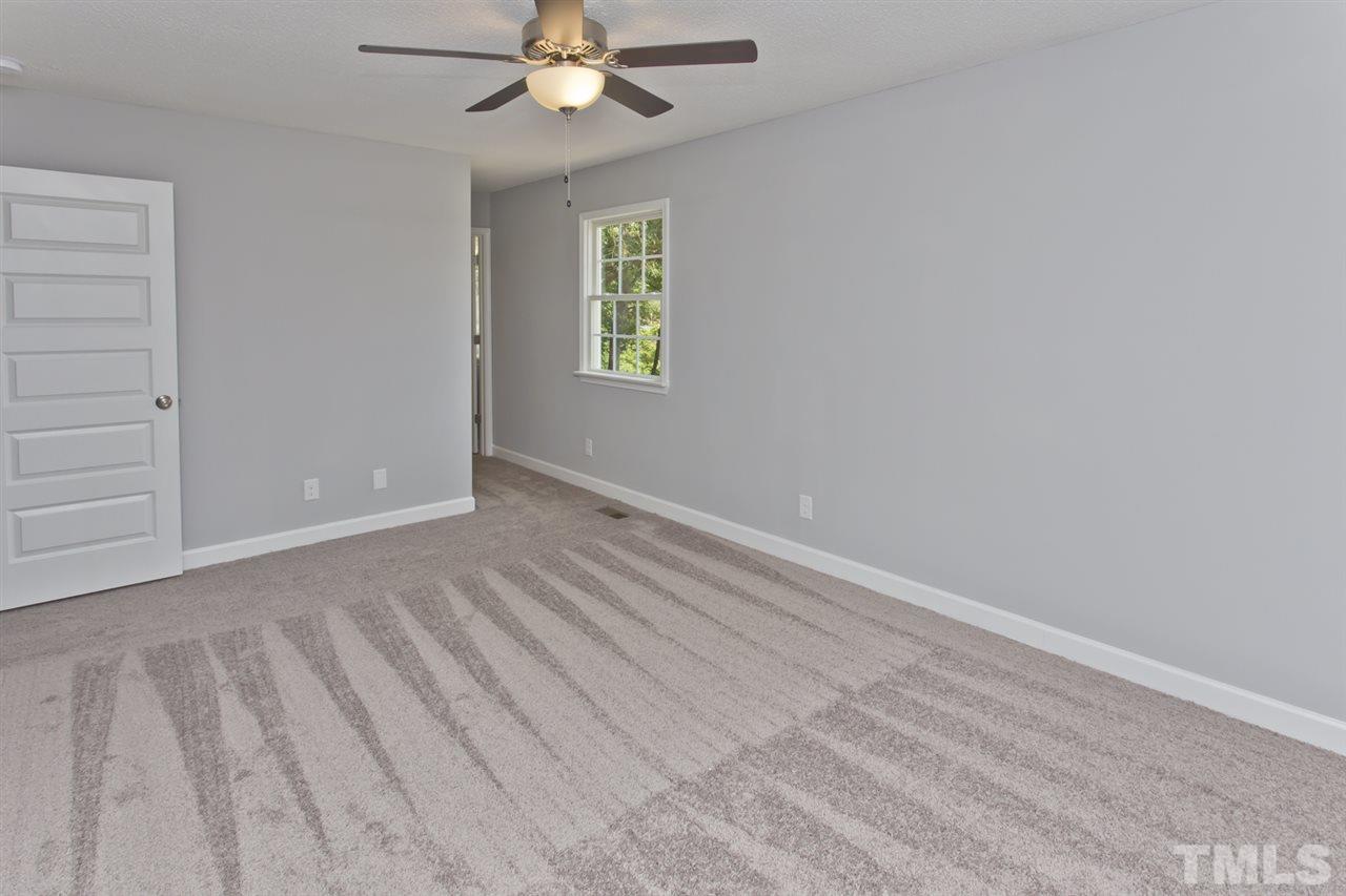 317 East Pilot Street Durham, NC 27707 - Photo 22 of 30 an empty room with windows and fan