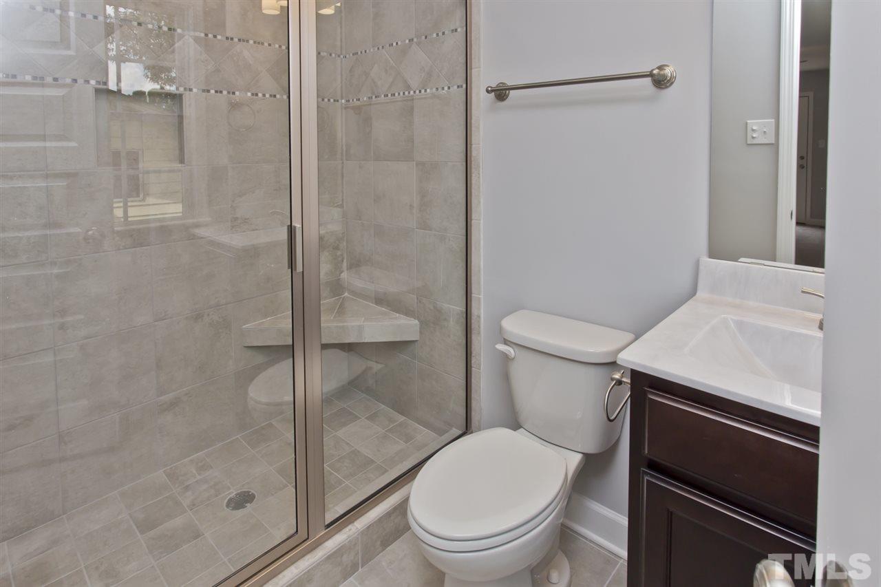 317 East Pilot Street Durham, NC 27707 - Photo 23 of 30 a white toilet sitting next to a bathroom sink