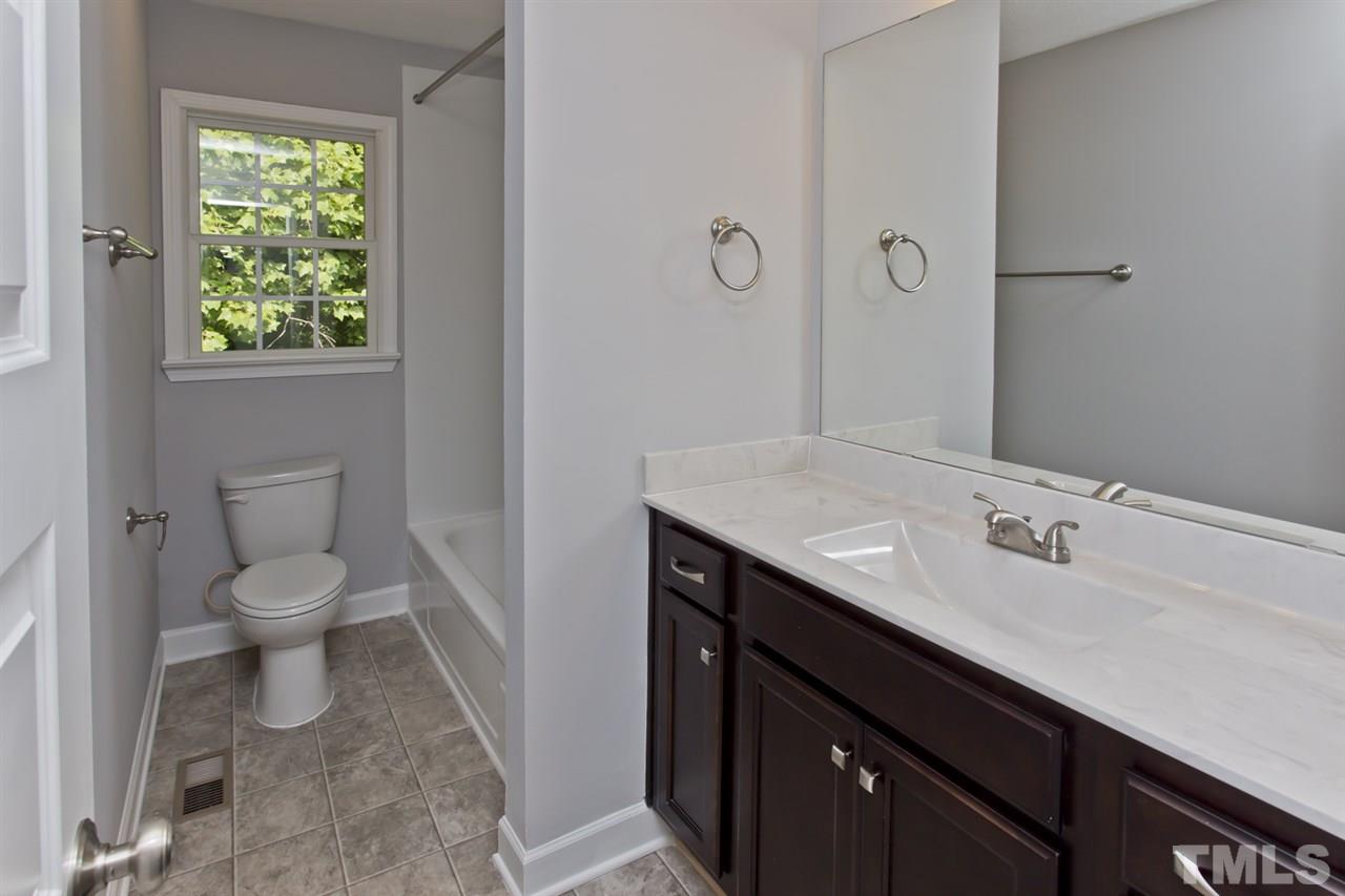 317 East Pilot Street Durham, NC 27707 - Photo 25 of 30 a bathroom with a sink and a toilet