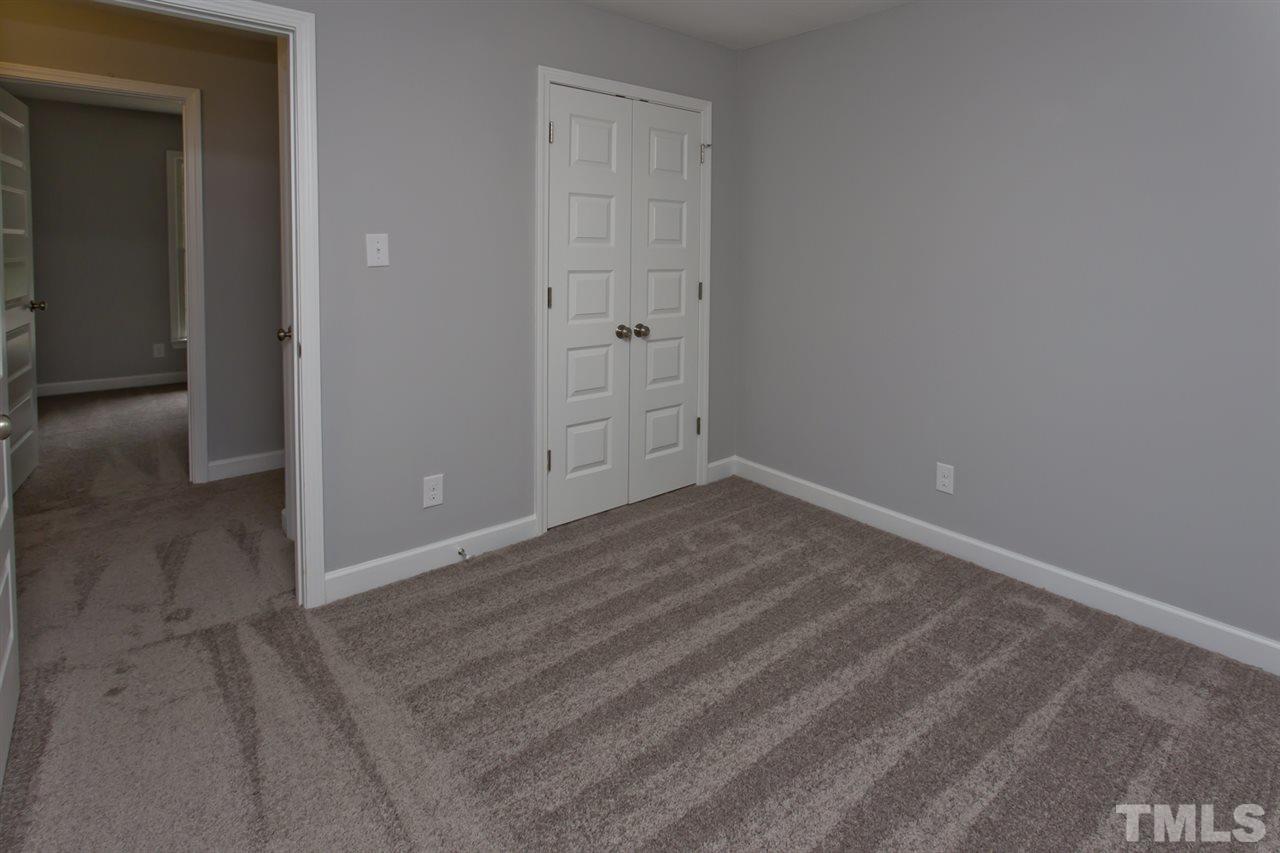 317 East Pilot Street Durham, NC 27707 - Photo 29 of 30 wooden floor and cabinet in an empty room