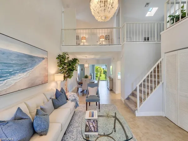 a living room with furniture and a table