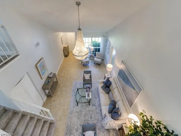 a view of living room with furniture and rug