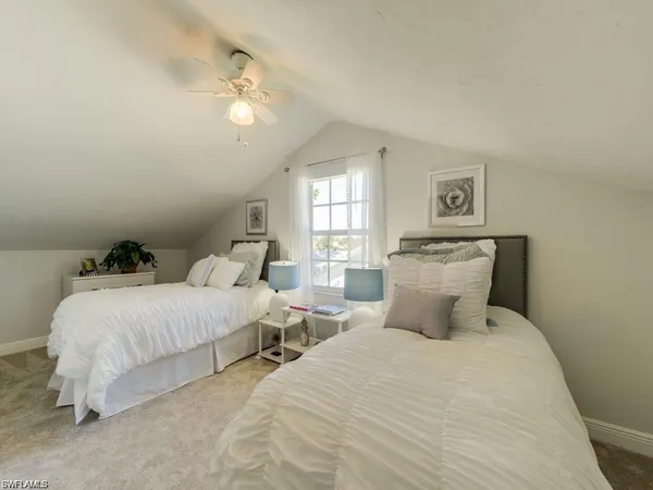 a bedroom with bed and a night stand