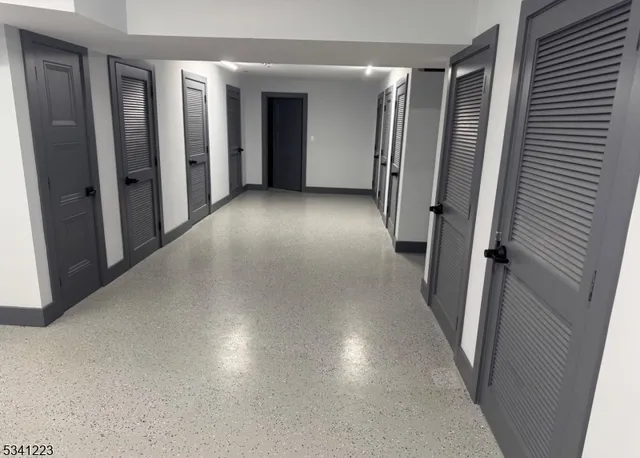 a view of a cars park in front of a building