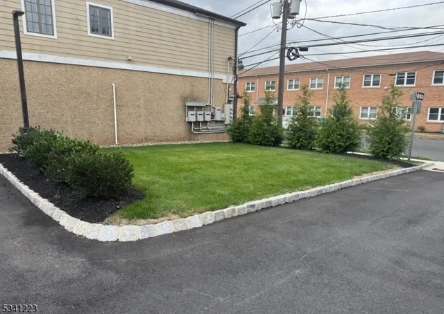 a kitchen with stainless steel appliances granite countertop a sink and a microwave