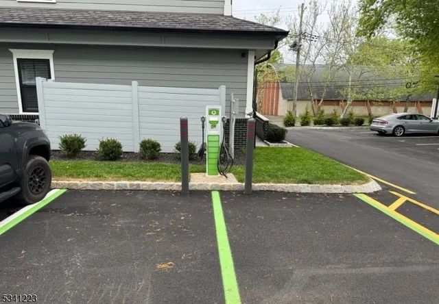 a kitchen with a sink cabinets and wooden floor