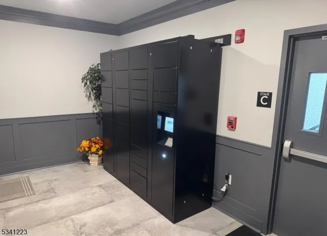 a bathroom with a shower and mirror