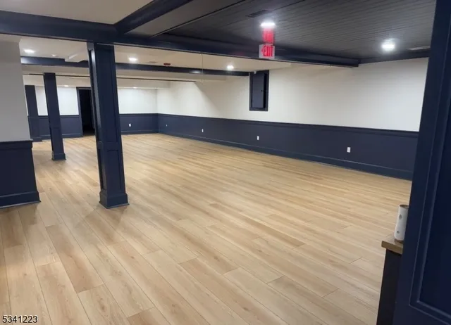 a view of a lobby room with wooden floor