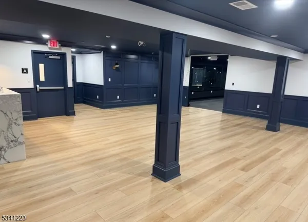 a view of kitchen with cabinets and wooden floor