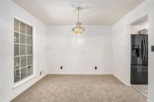 a view of empty room with windows