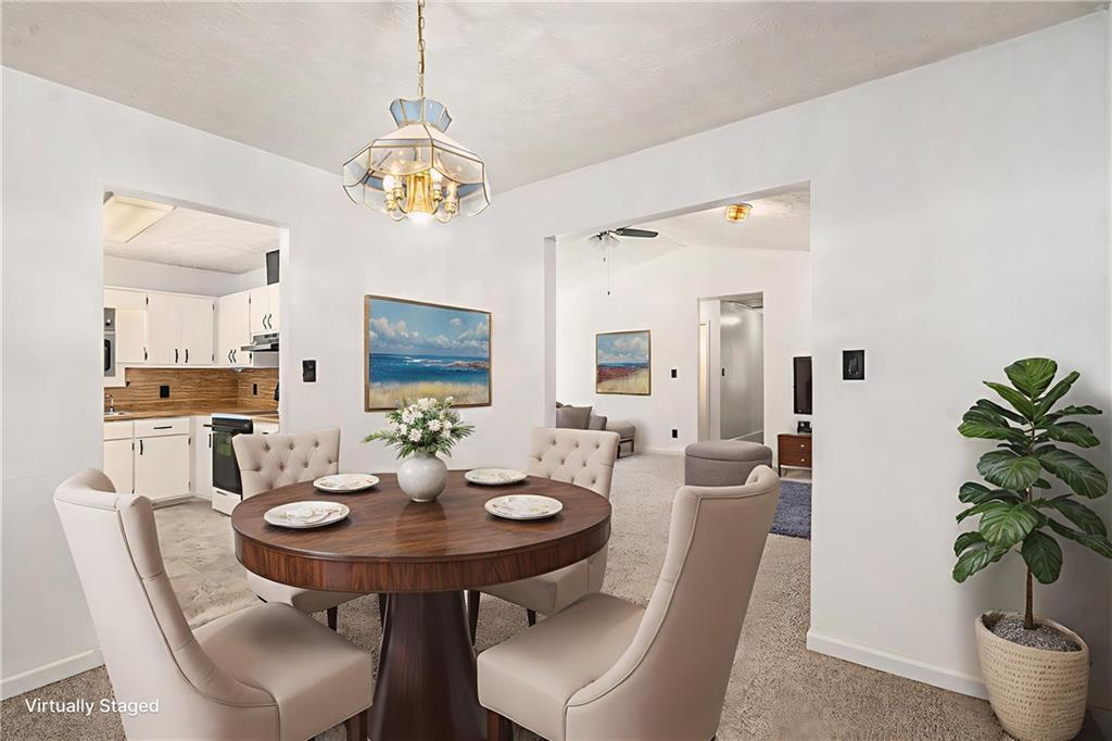 551 Hood Road Stockbridge, GA 30281 - Photo 13 of 49 a view of a dining room with furniture and wooden floor