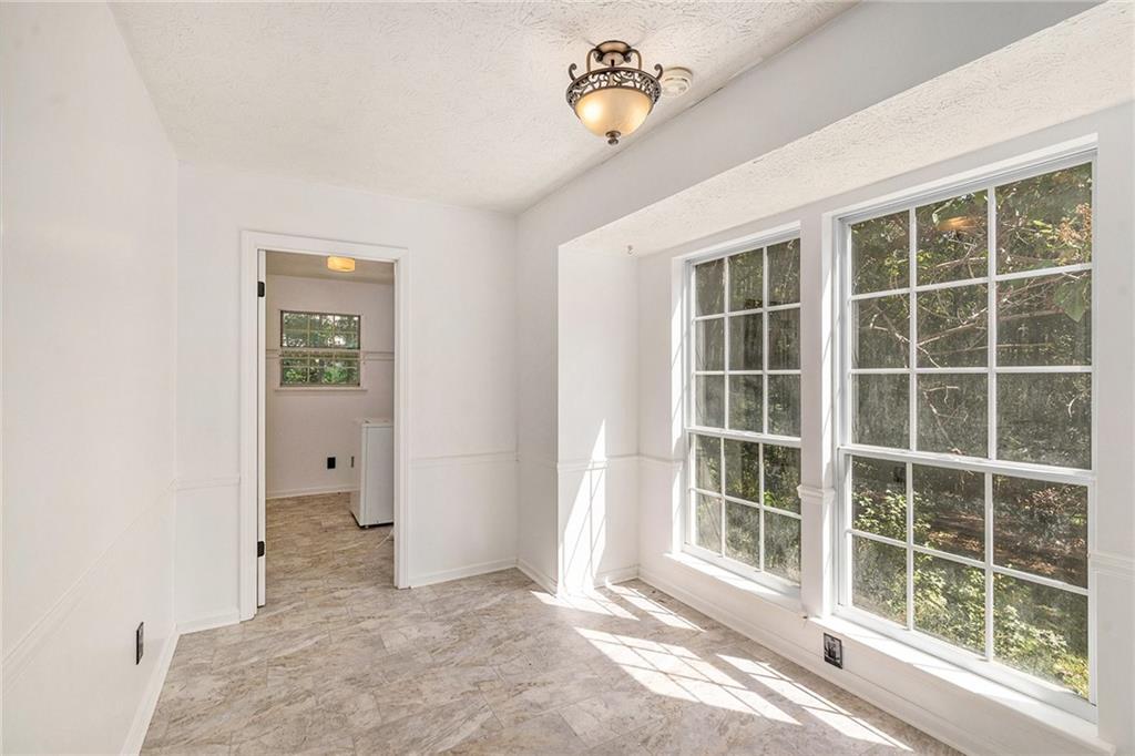 551 Hood Road Stockbridge, GA 30281 - Photo 17 of 49 a view of an empty room with a window