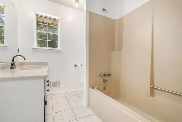 a bathroom with a sink and a bathtub