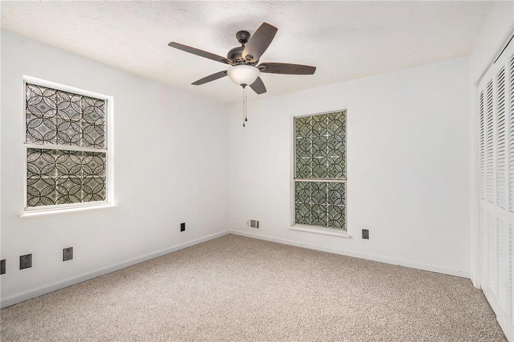 551 Hood Road Stockbridge, GA 30281 - Photo 24 of 49 a view of an empty room with a window