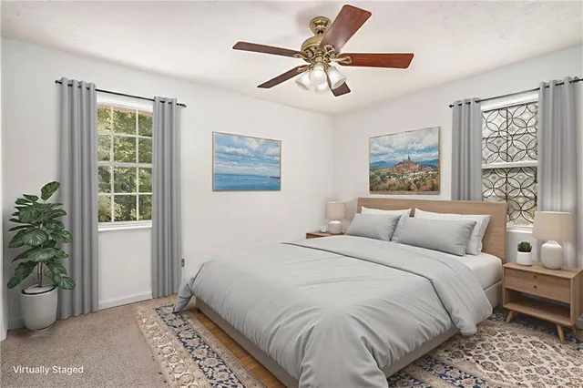 a bedroom with a large bed and a window