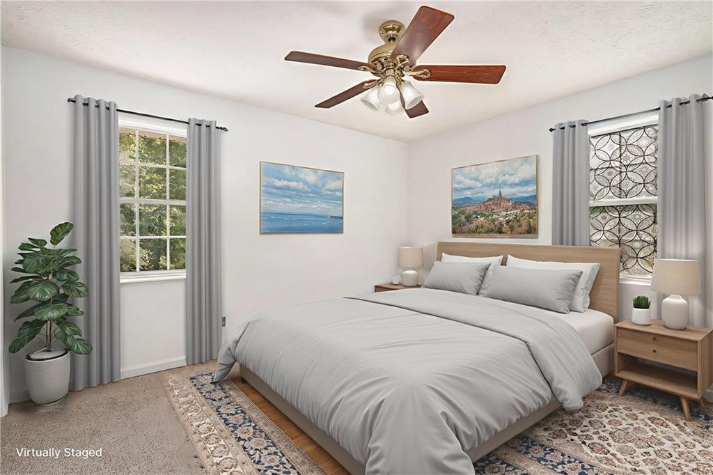 551 Hood Road Stockbridge, GA 30281 - Photo 25 of 49 a bedroom with a large bed and a window