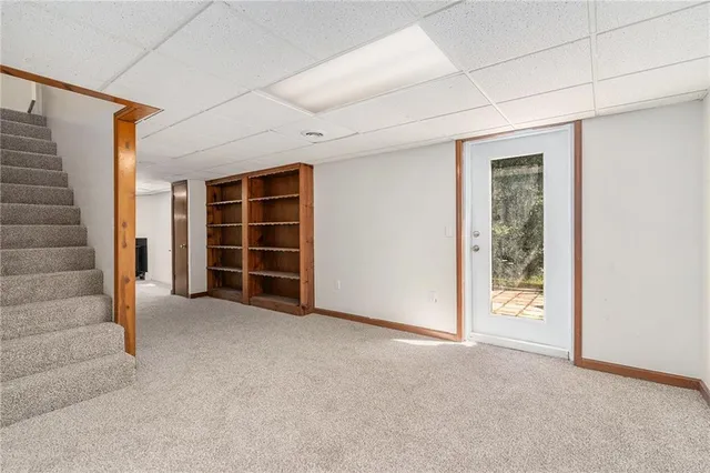 an empty room with a empty space and windows