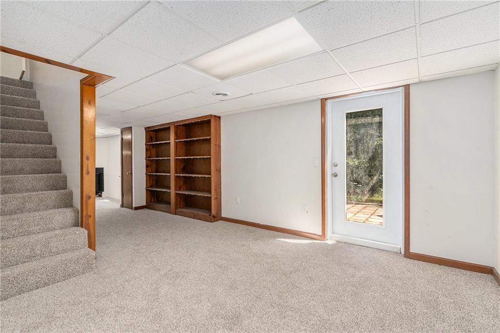 551 Hood Road Stockbridge, GA 30281 - Photo 29 of 49 an empty room with a empty space and windows