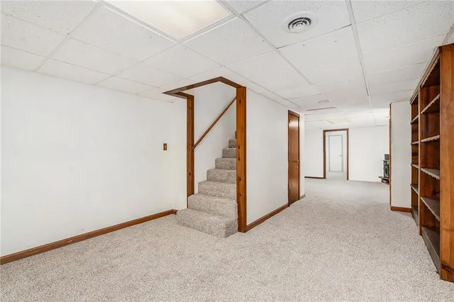 a view of a hallway with staircase
