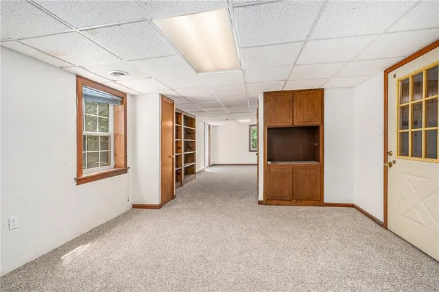 a view of an empty room with a window