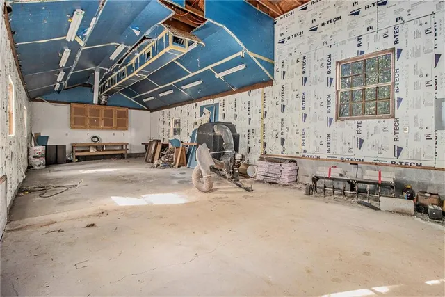 a view of a patio with table and chairs