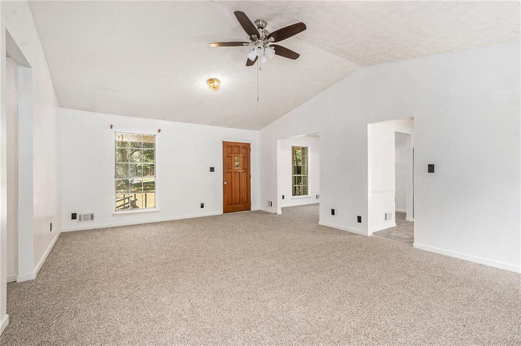 551 Hood Road Stockbridge, GA 30281 - Photo 7 of 49 a view of an empty room with a window