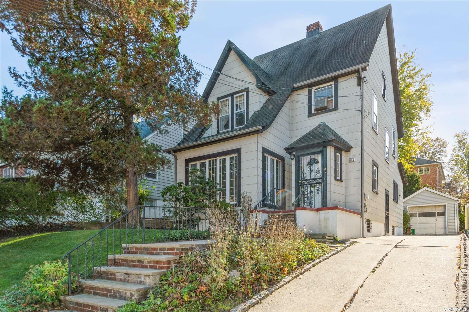 82 Nassau Road Queens, NY 11363 - Photo 1 of 1 a front view of a house with a yard