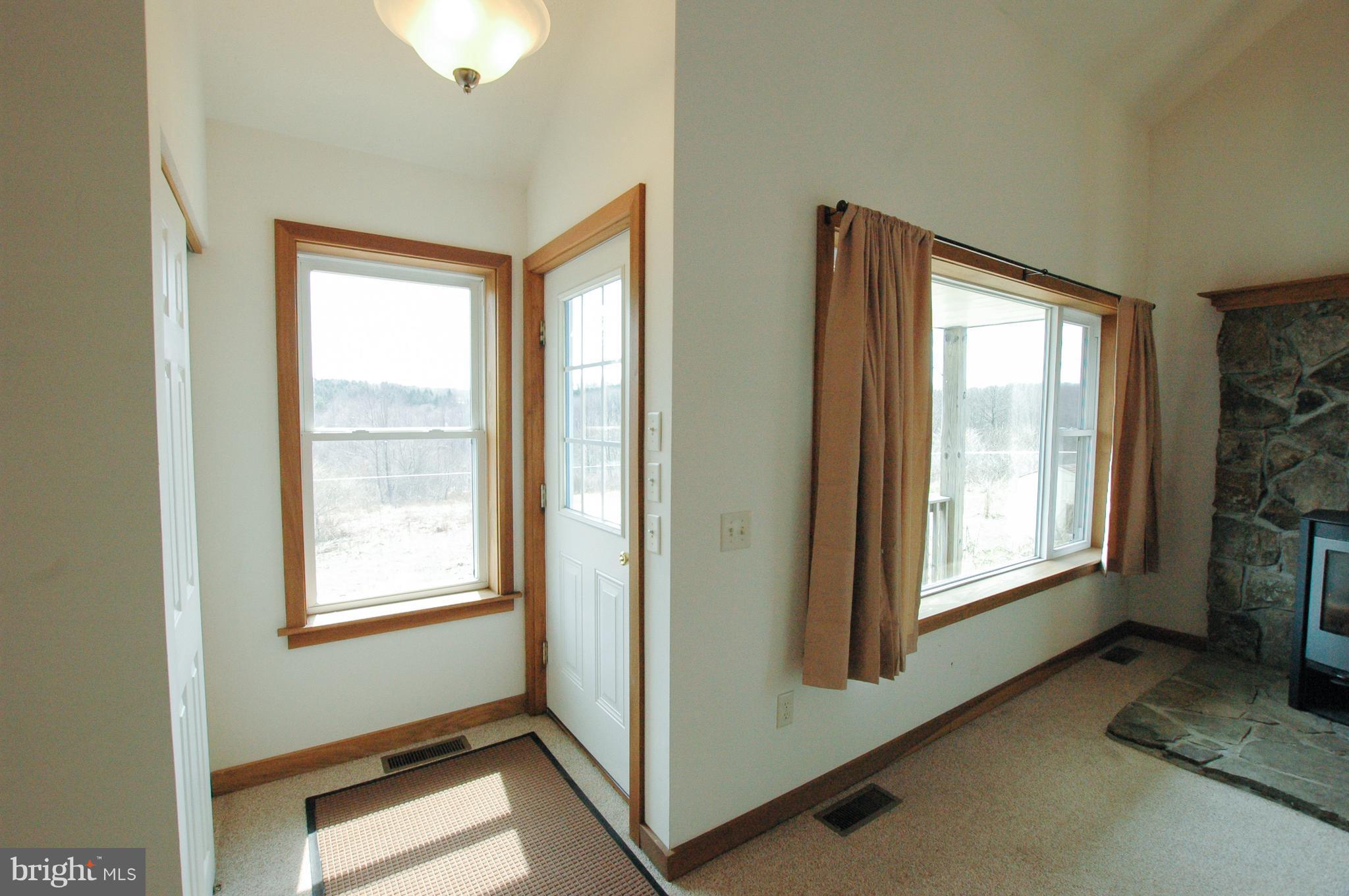 1049 Feather Road Terra Alta, WV 26764 - Photo 15 of 29 Front door entrance with cost closet and views