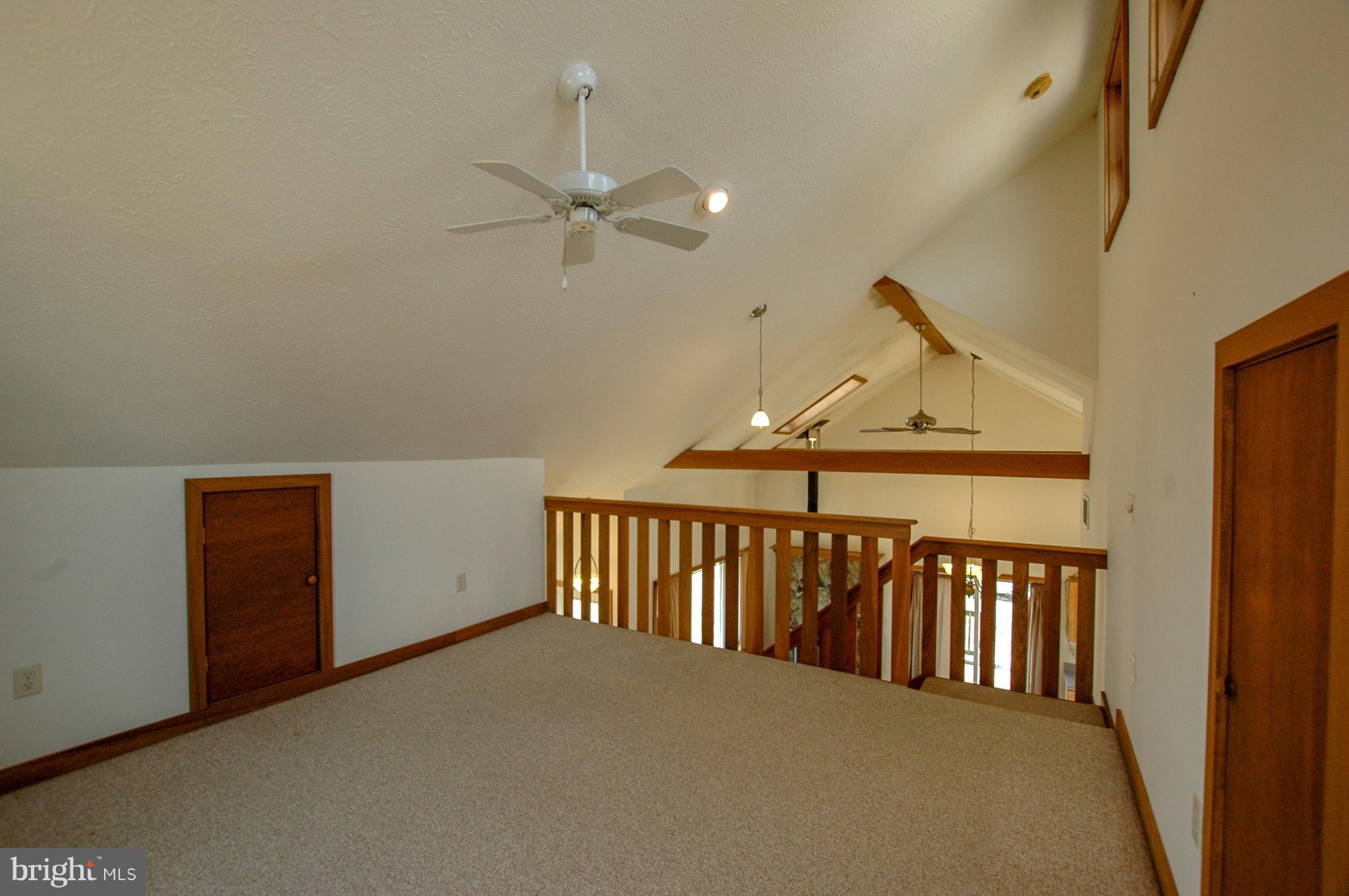 1049 Feather Road Terra Alta, WV 26764 - Photo 21 of 29 Upper Level Loft area with lots of natural light