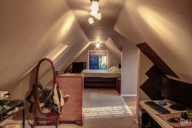 a view of a hallway with workspace and mirror